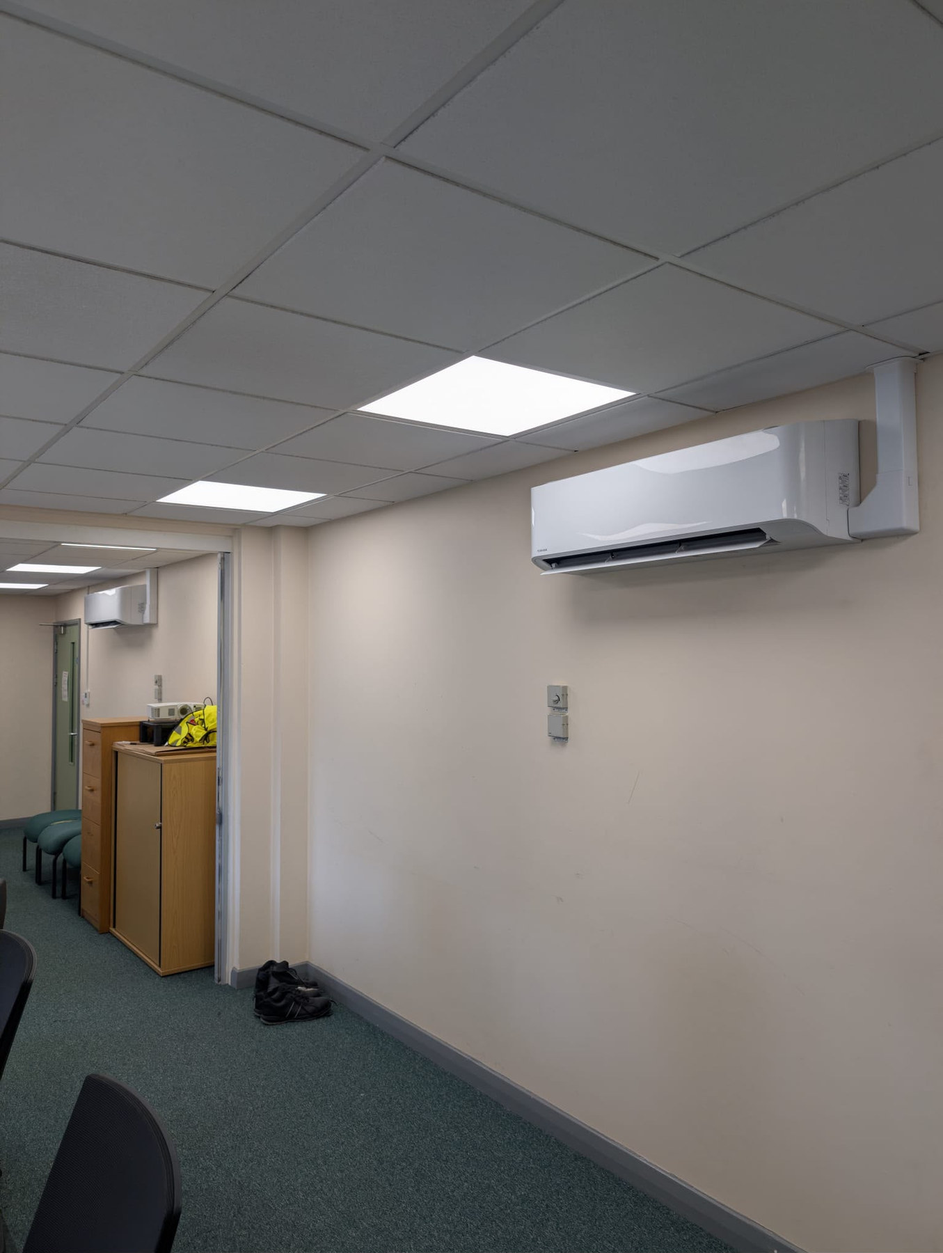 Wall-mounted air conditioning unit in an office