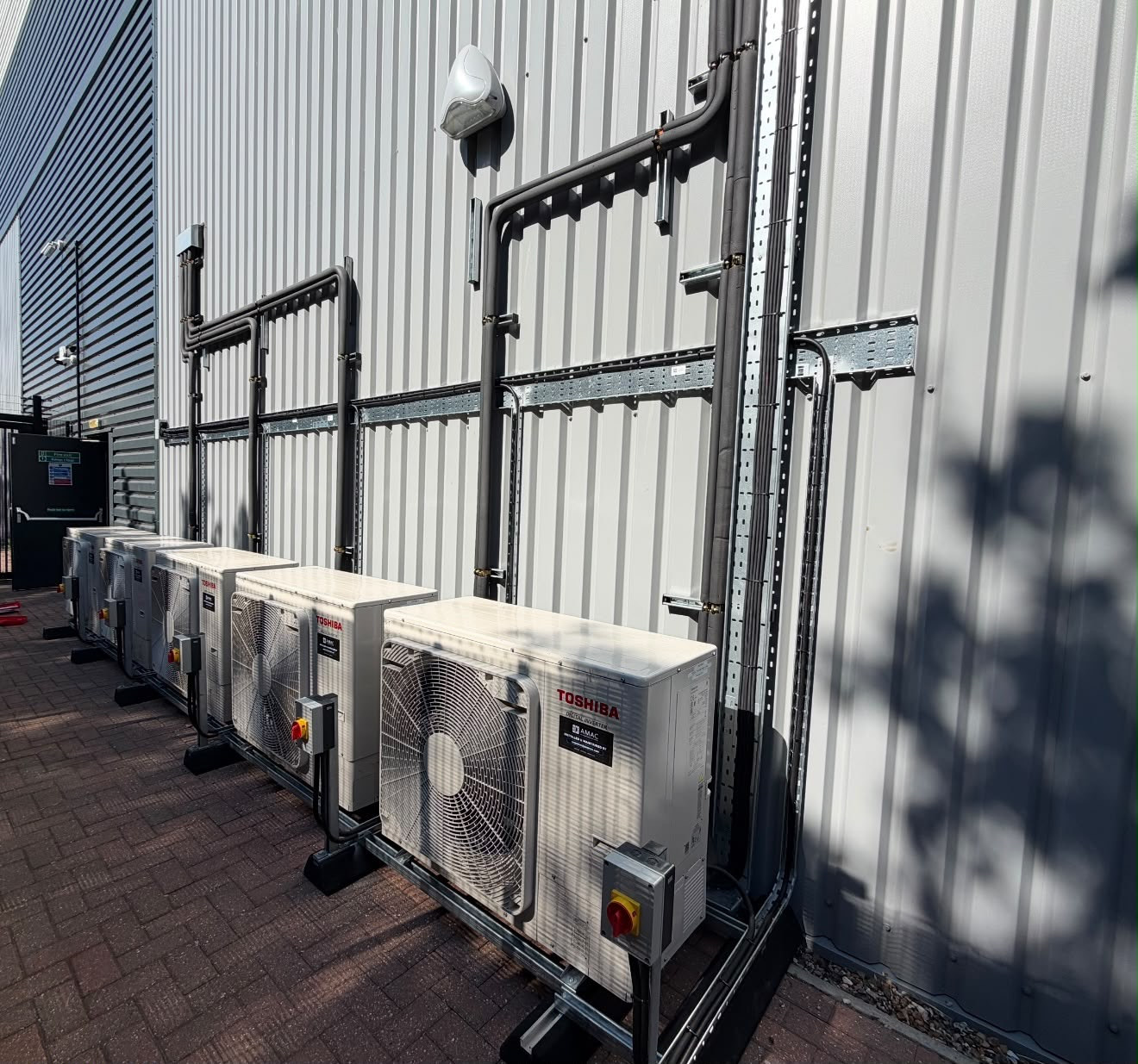 Row of condensing units installed at a pharmaceutical storage facility